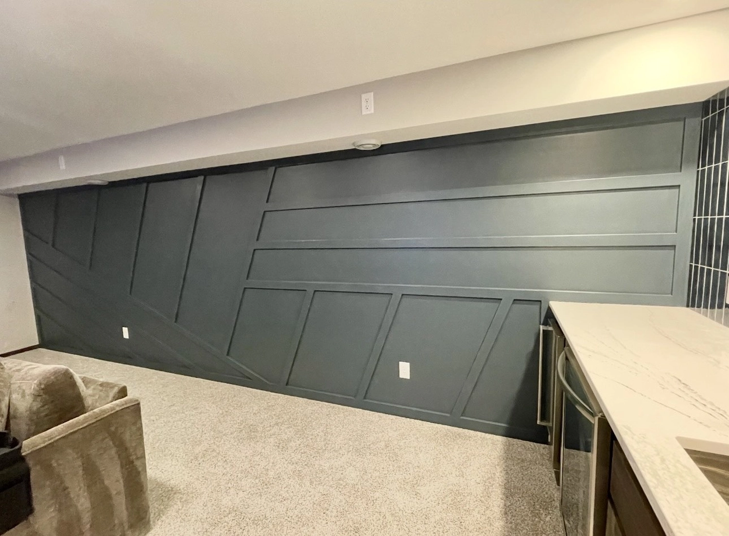 Forest green board-and-batten wall paneling by Bond Trim LLC